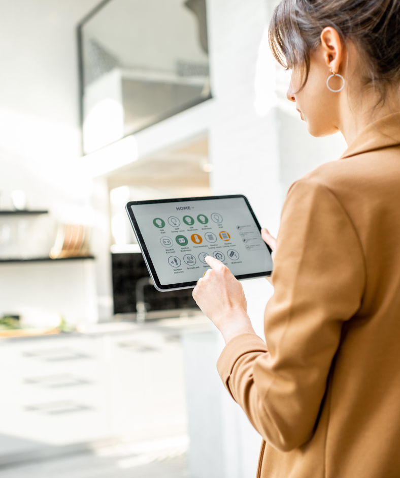 An image of a woman holding a tablet with a smart home management application to represent artificial intelligence in daily life